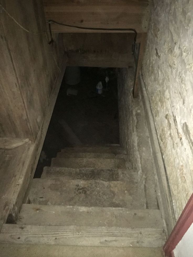 the stairs lead up to an old building with no people on them or anything else