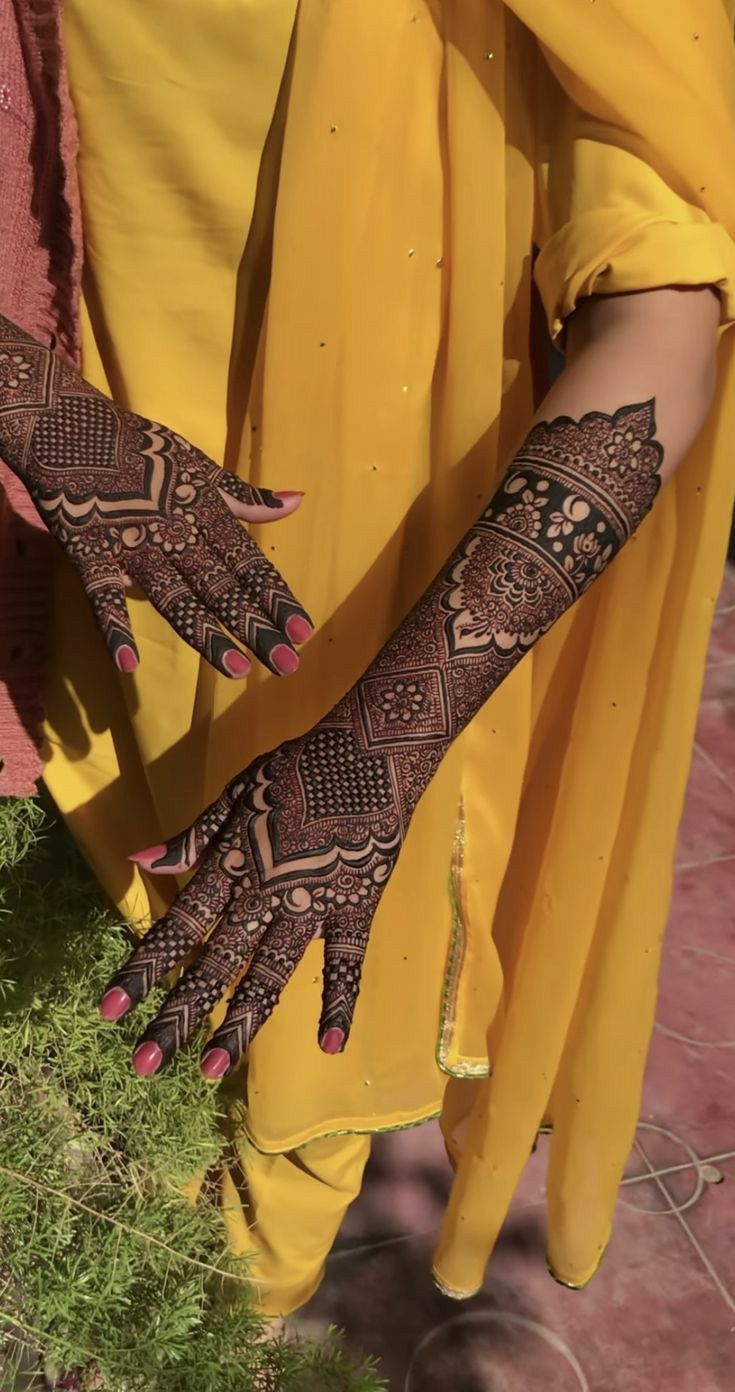 a woman with henna on her hands