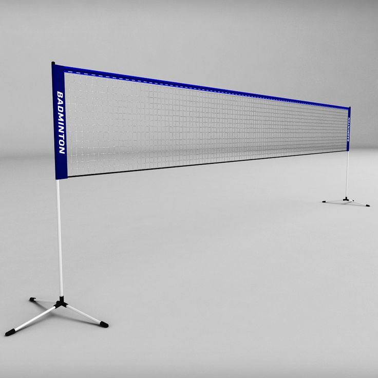 a volleyball net on a tripod in an empty room