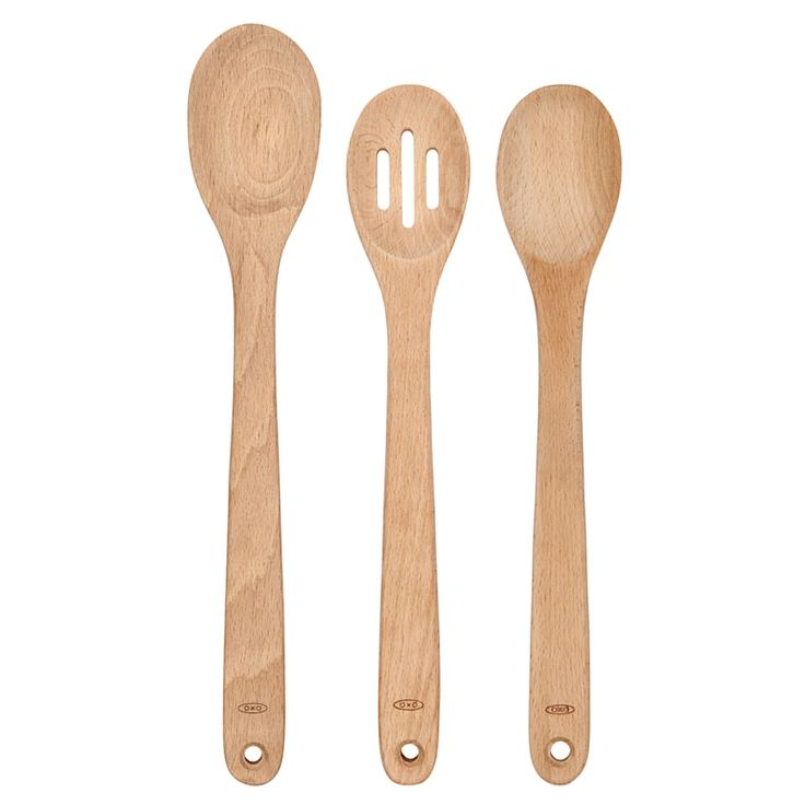 three wooden utensils and spoons on a white background