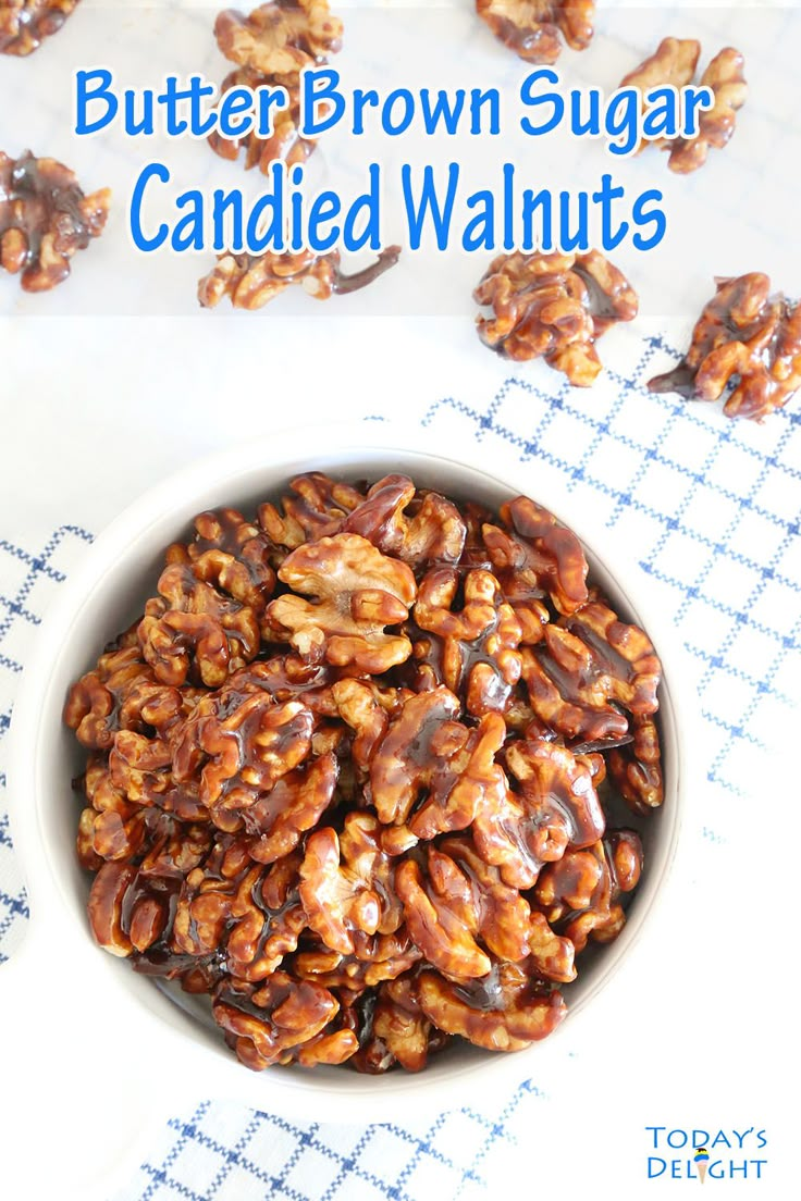 a bowl filled with candied walnuts on top of a table