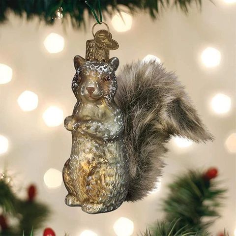 a squirrel ornament hanging from a christmas tree