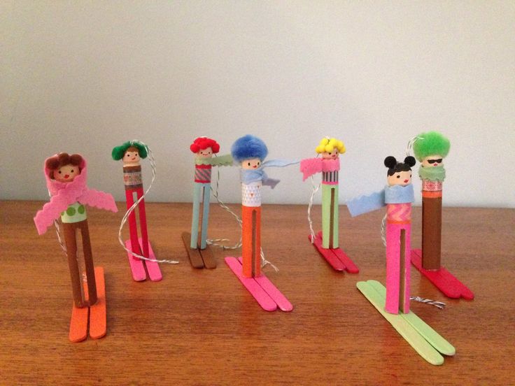 the wooden toy skis are lined up on the table with different types of toys