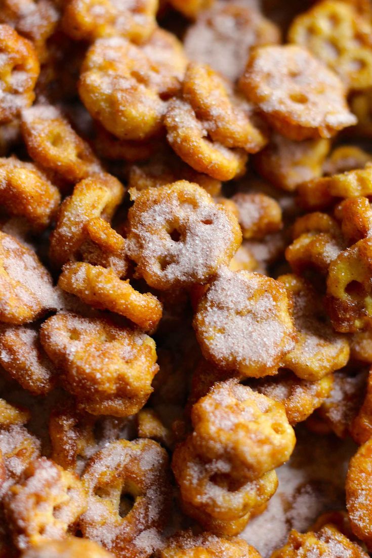 a close up view of fried food with powdered sugar