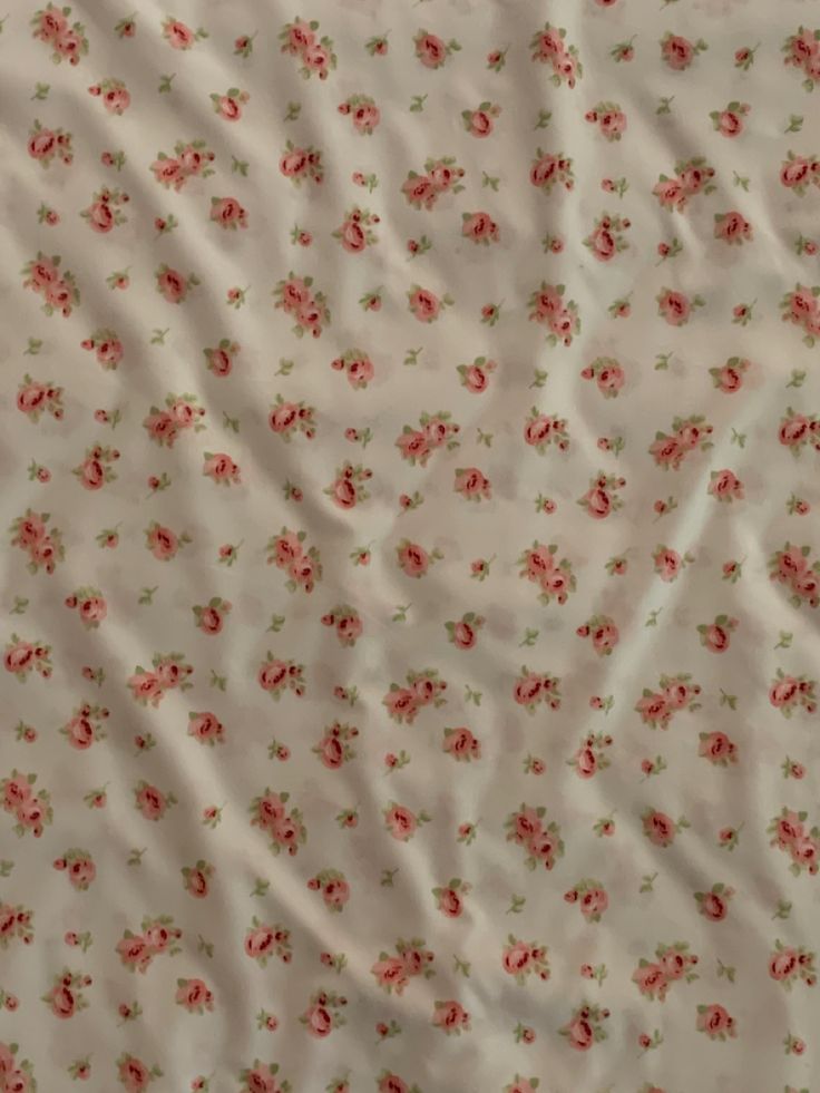 the fabric has pink flowers on it