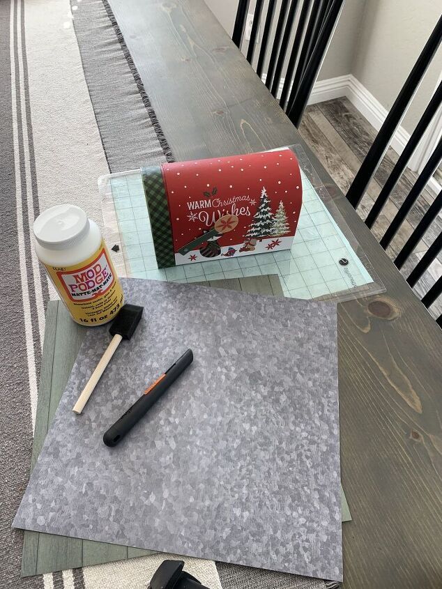 the table is set up with supplies for making christmas cards and other holiday decorating items