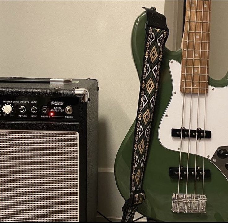 an electric guitar and amp sitting next to each other