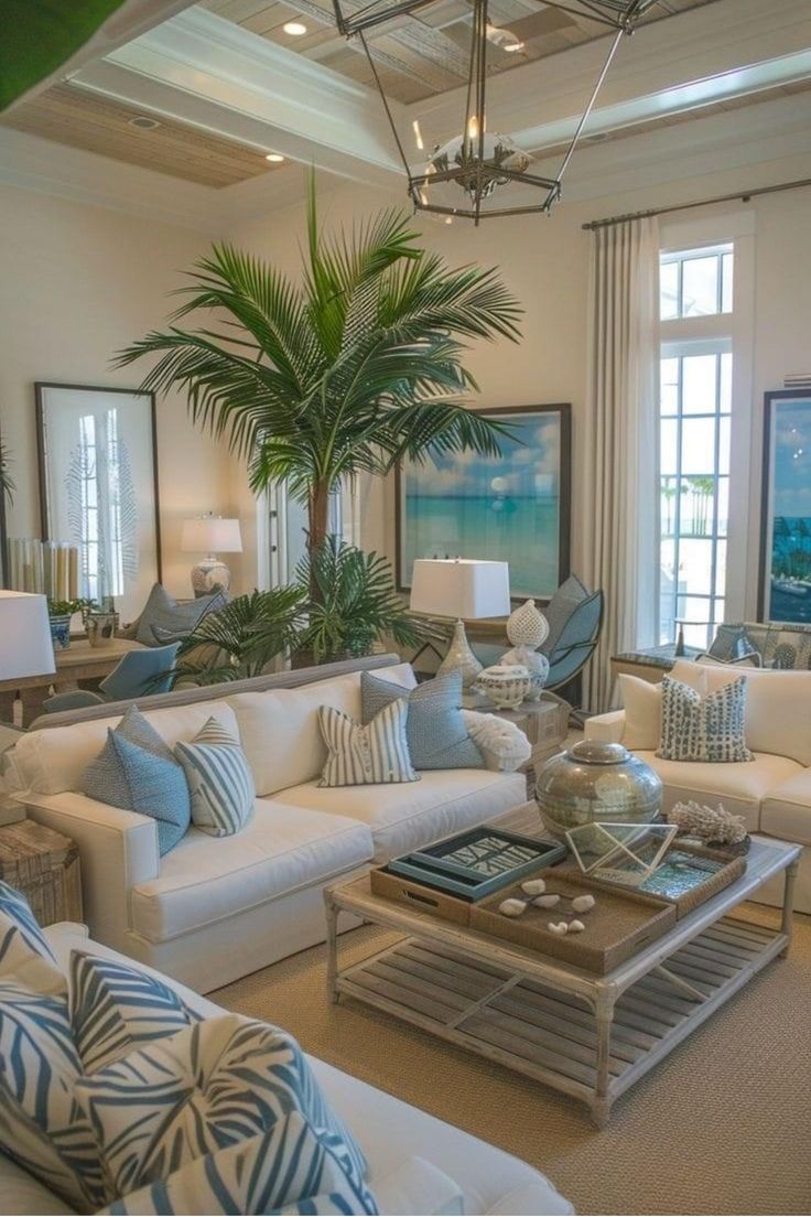 a living room filled with furniture and a palm tree in the middle of the room