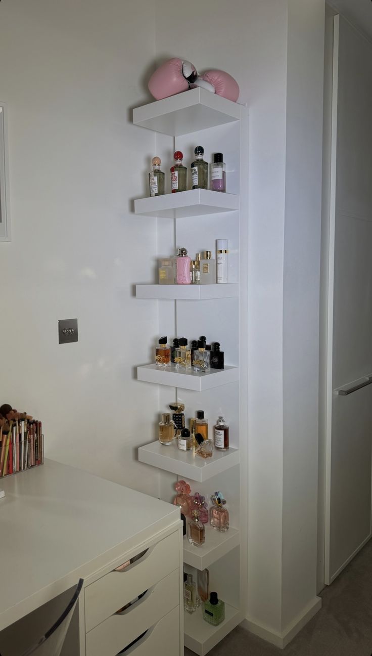 a white shelf filled with lots of bottles