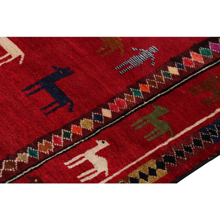 a red rug with animals on it