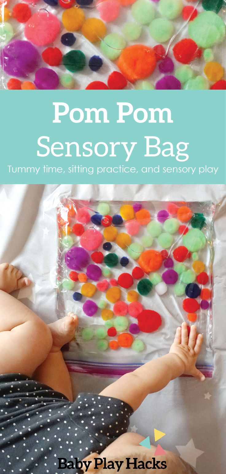 a baby playing with pom - pom sensory bag for toddlers to play