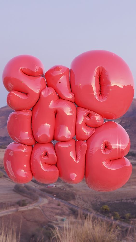 the words love are made out of balloons