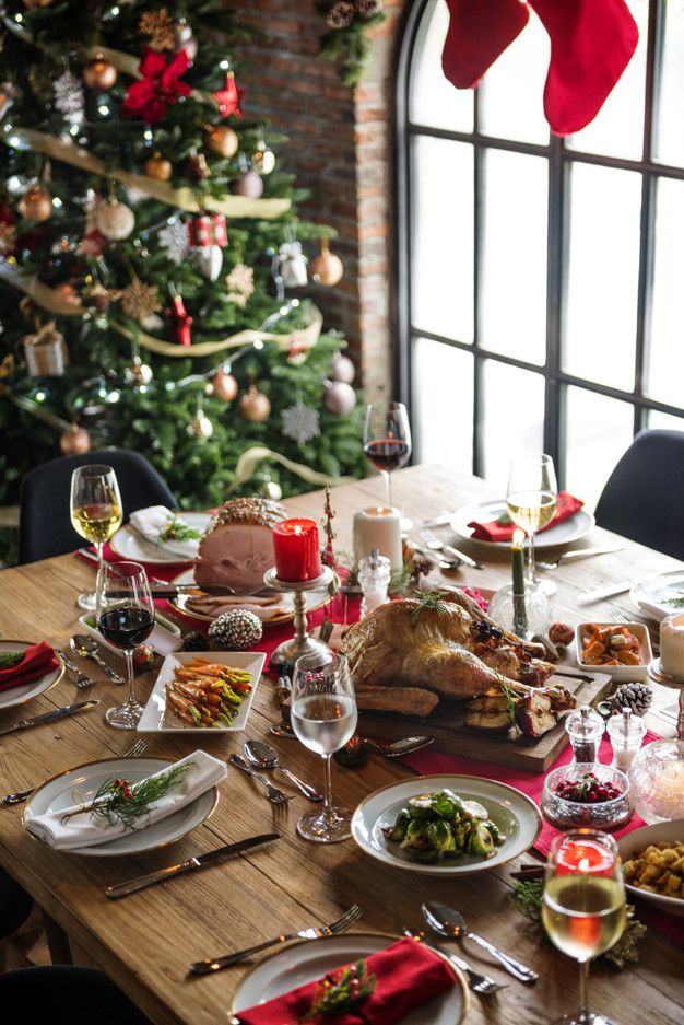 a dining table set for christmas dinner