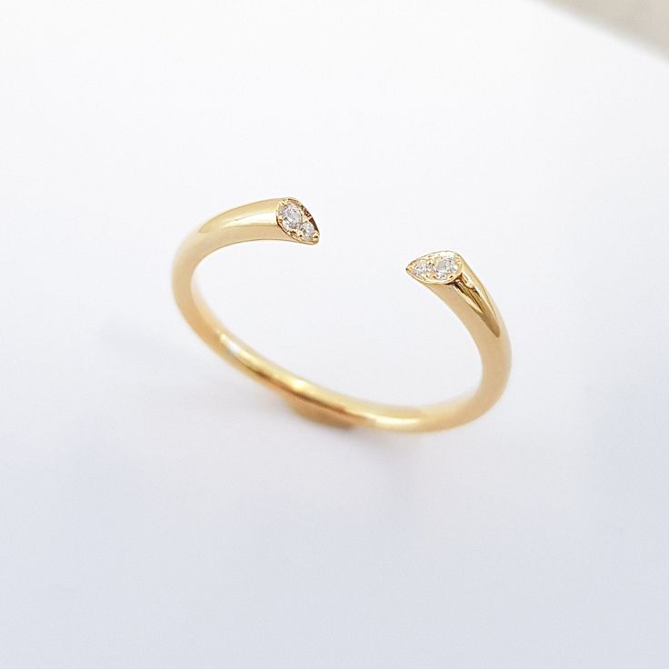 "★ ★ ★ Made with solid gold to ensure the strength of the ring.★ ★ ★ This diamond cuff ring, part of our \"Minimal Collection\" is a delicate, fashion piece to wear as well as an index ring or knuckle ring. Use as a standalone piece or with stacking rings. Item Details ❤ Made to Order ✔ Available Gold Color: Rose Gold, Yellow Gold, White Gold, ✔ Number of Diamonds: 4, total carat weight: 0.03Ctw, ✔ Diamond Color: G Color ✔ Diamond Clarity: VS ✔ Band details: Top Width: 2.4mm Thickness: 3.0mm Bot Luxury Midi Open Ring For Gift, Diamond Open Ring, Stackable Open Rings With Single Diamond For Promise, Single Diamond Stackable Open Rings For Promise, Luxury Classic Wide Band Open Ring, Luxury Platinum Open Band Ring, Diamond Open Ring Midi Rings For Promise, Open Ring With Single Diamond, Diamond Open Midi Rings For Promise