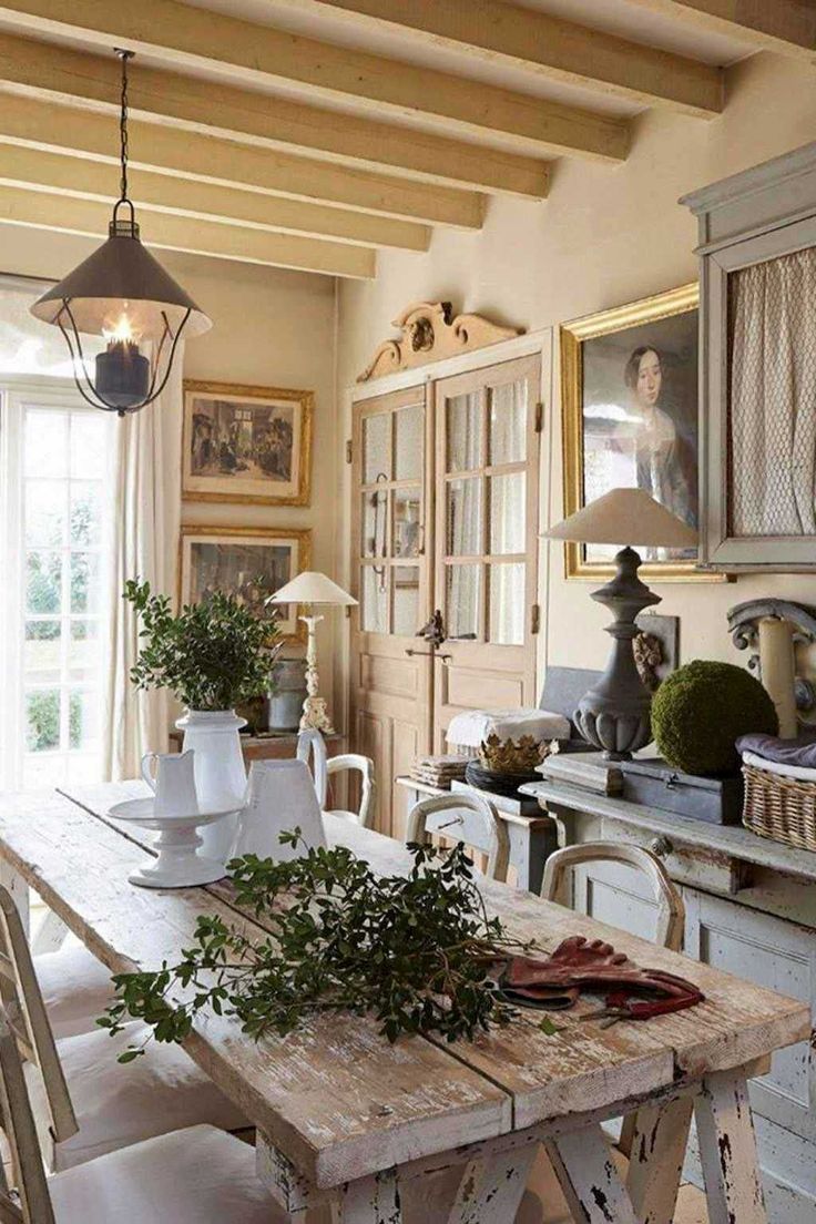 a dining room table and chairs in front of an open door