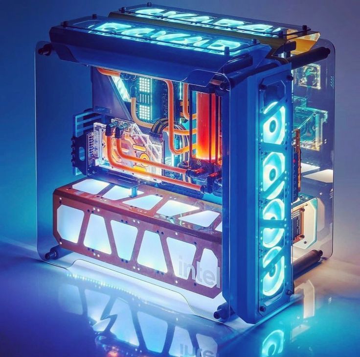 the inside of a computer case is lit up with blue lights and neon letters on it