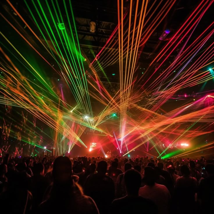 people are watching laser lights in the dark