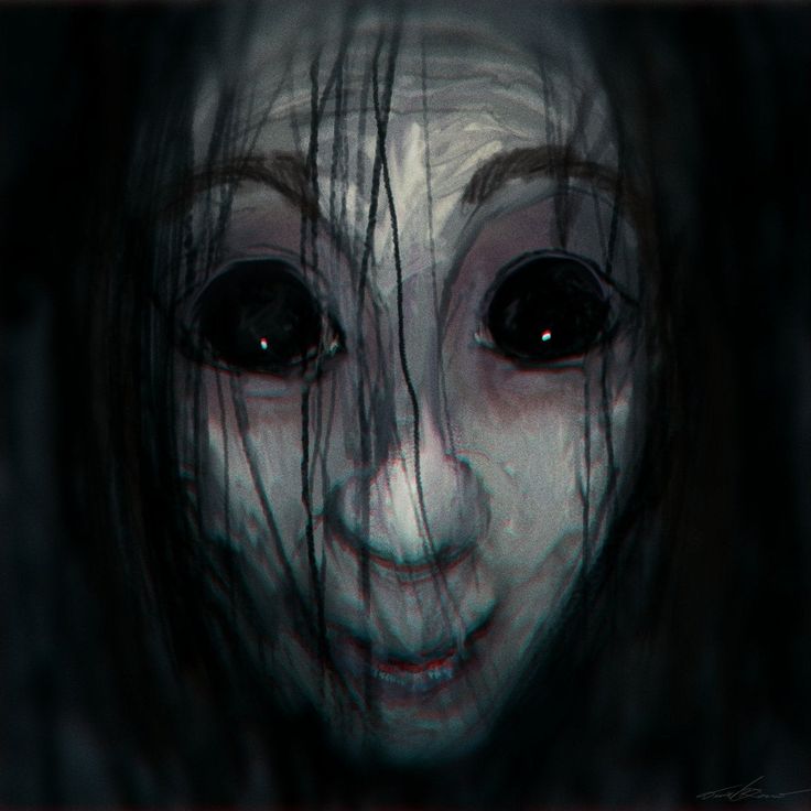 a creepy doll with long hair and eyes looking at the camera, while staring into the camera