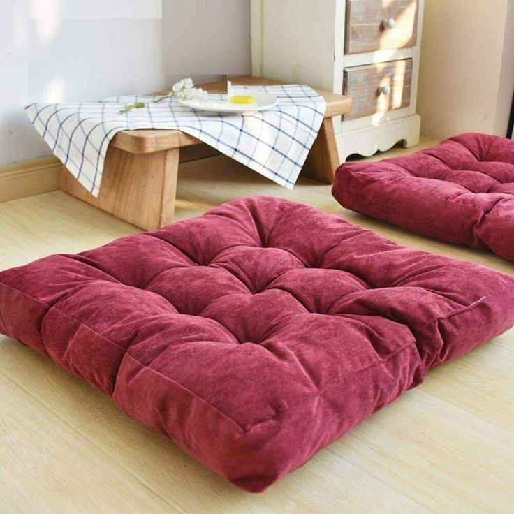 two futon mattresses sitting on the floor next to each other