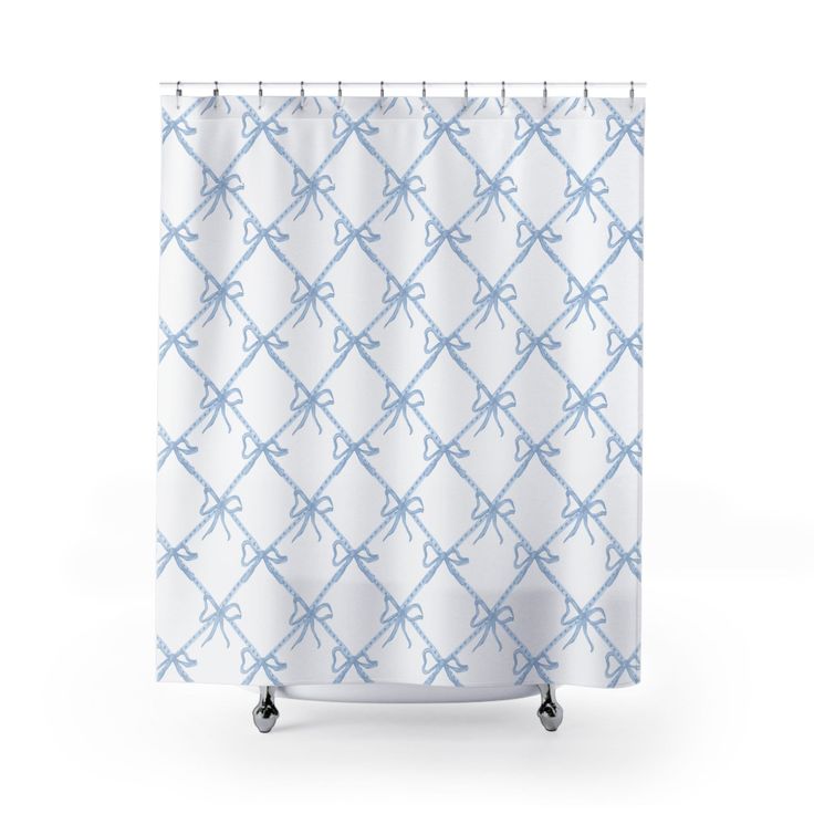 a blue and white shower curtain with an abstract pattern in the middle, on wheels