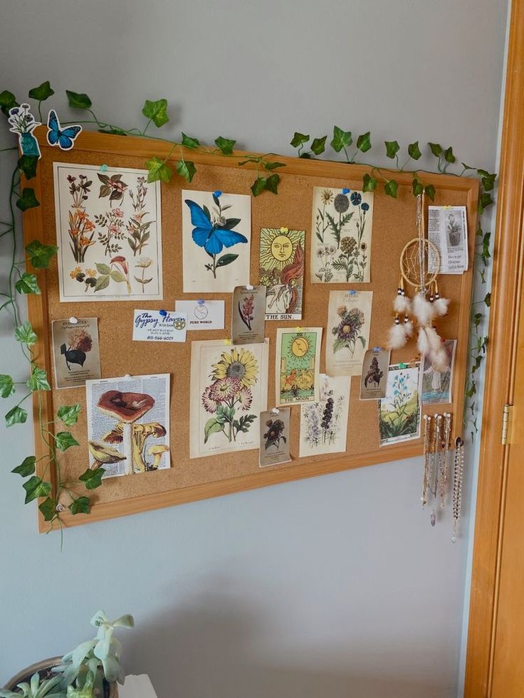 a bulletin board with pictures and magnets attached to it, hanging on the wall