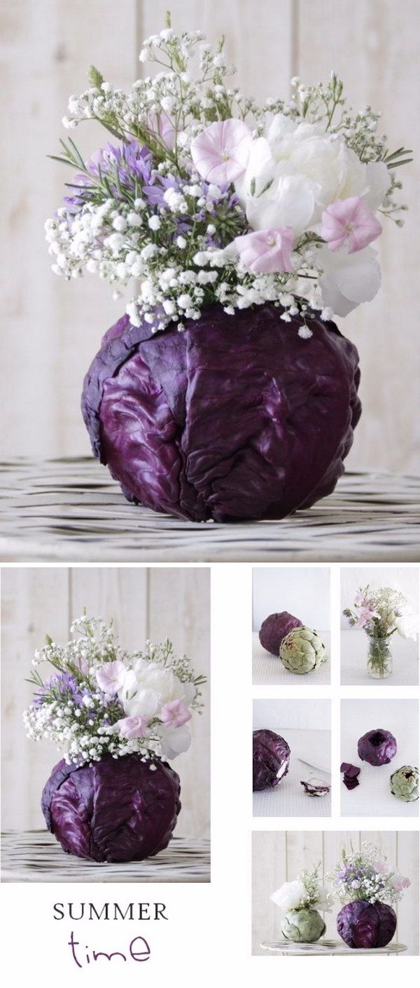 an arrangement of flowers in a purple vase with white and pink flowers on the top