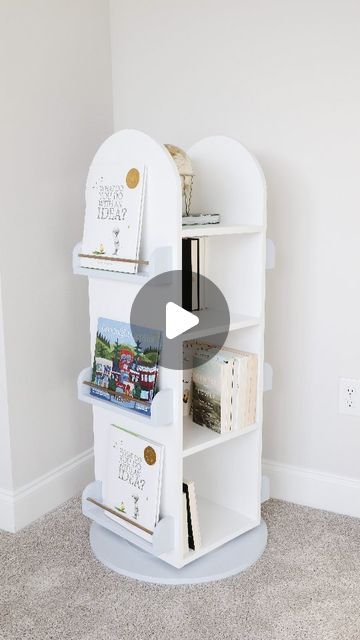 a white book shelf sitting in the corner of a room