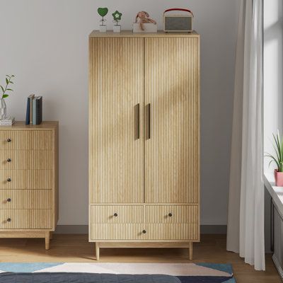 a wooden cabinet sitting next to a window on top of a rug in a living room