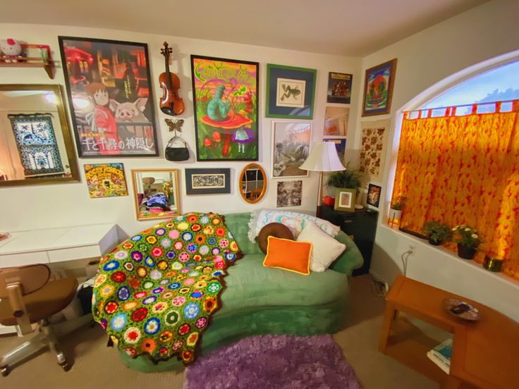 a living room filled with furniture and pictures on the wall