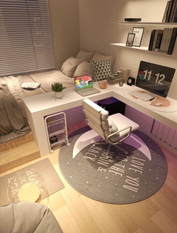 a room with a bed, desk and chair in it