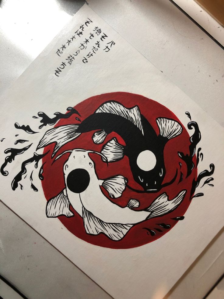 a drawing of two koi fish in front of a red and white circle with writing on it