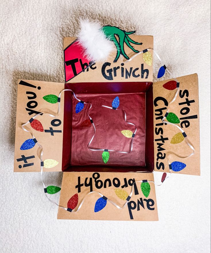 the grinch christmas ornament is in its box