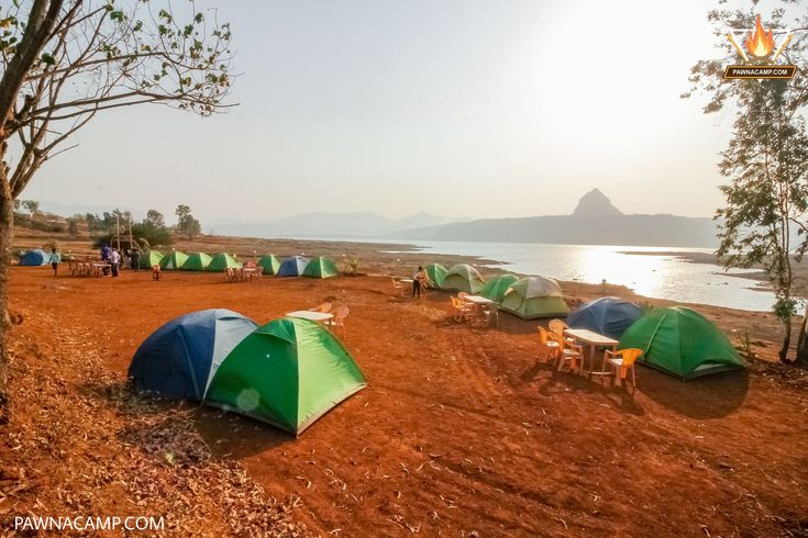 there are many tents set up on the beach