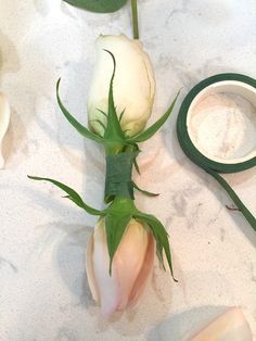 some flowers and scissors on a table