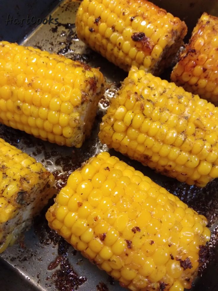 grilled corn on the cob in a pan