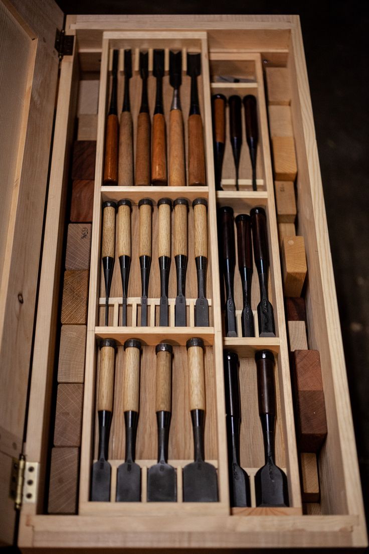 a wooden box filled with lots of different tools