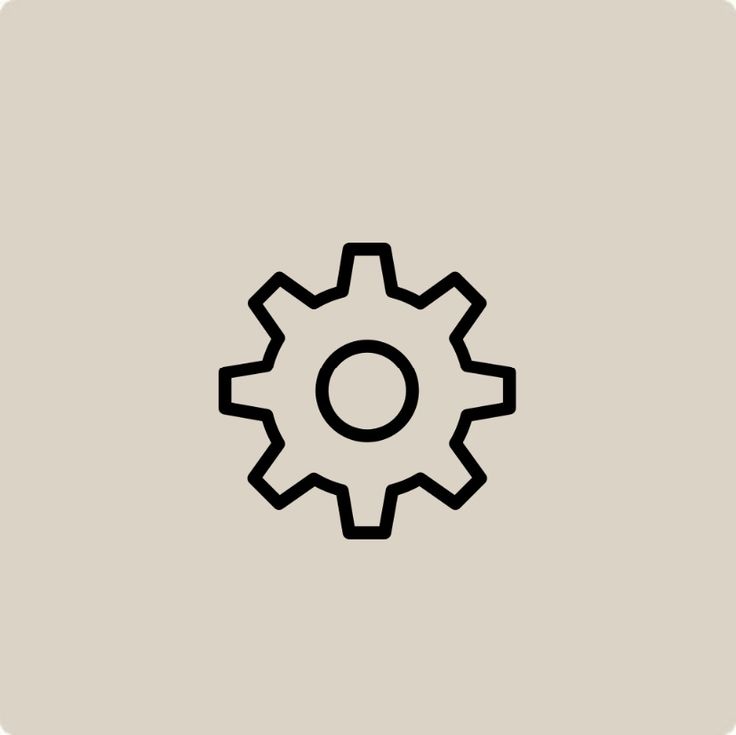 a black and white image of a gearwheel on a gray background with the word,