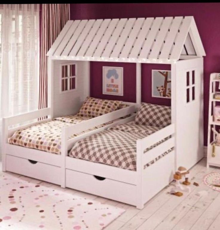 a child's bedroom with two beds and a book shelf