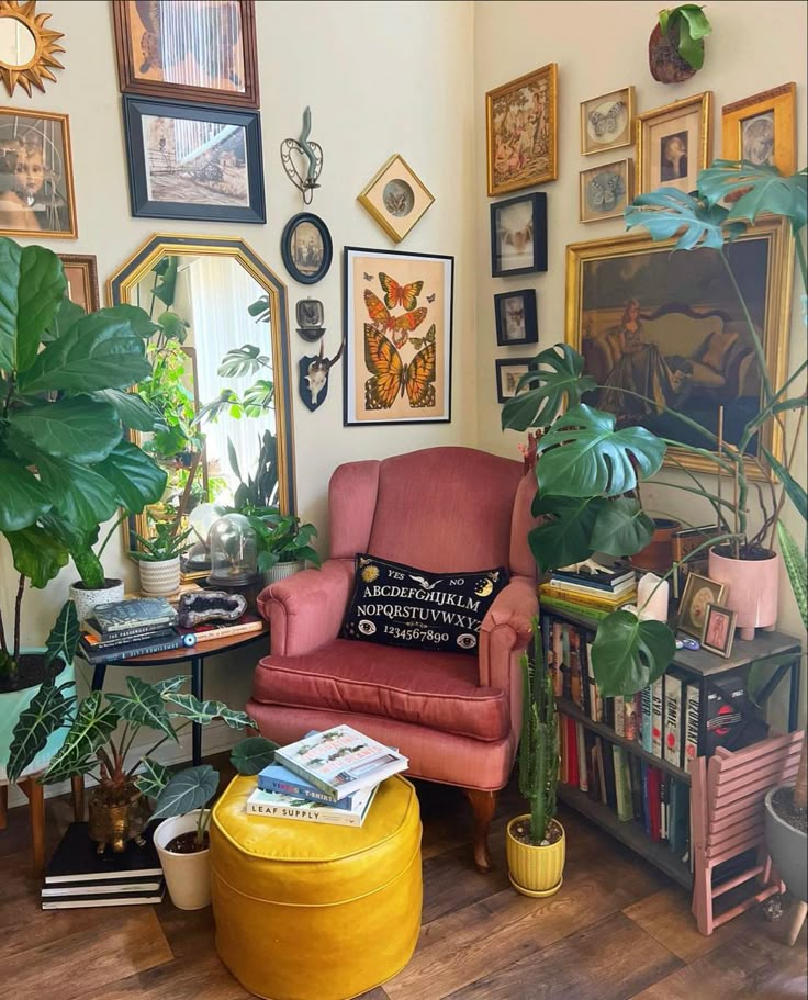 a living room filled with lots of plants and pictures