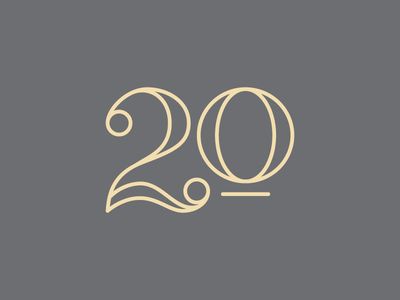 the number twenty two with an image of a woman's face in gold on a gray background