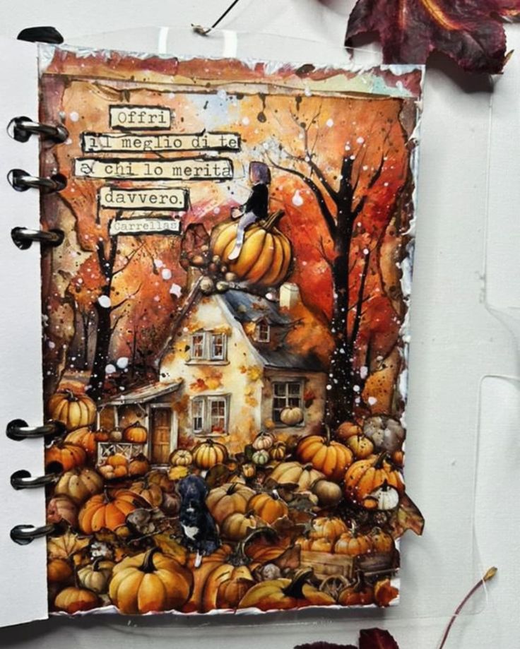 an art journal with pumpkins on the pages