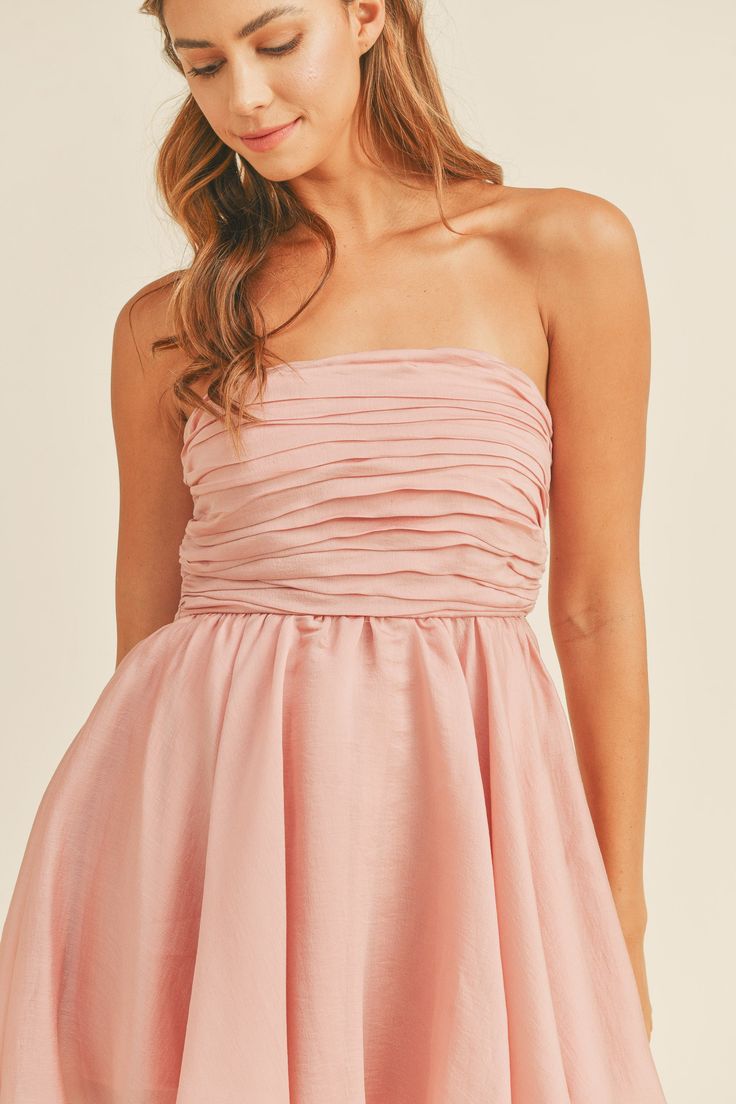 This stylish and versatile Strapless Babydoll Dress features a gathered, ruched, and pleated bust for a flattering fit. The back exposed zipper detail adds a touch of modernity, while the back smocking ensures comfort and flexibility. With a lining included, this dress is perfect for both casual and dressy occasions. Strapless Babydoll Dress, Exposed Zipper, New Tops, Cream Dress, Zipper Detail, Babydoll Dress, Sale House, Denim Dress, Smocking