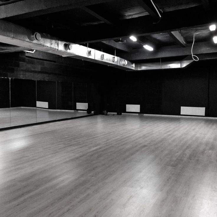 an empty dance studio with mirrors and lights