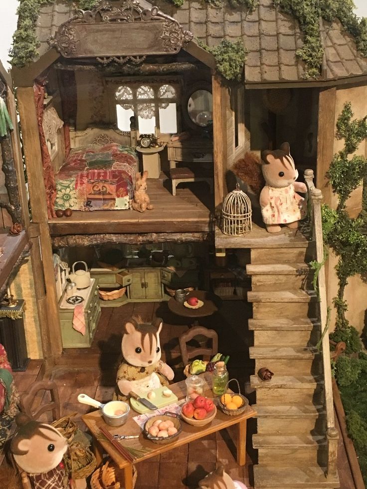 a doll house with several dolls in it