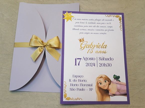 a purple and yellow wedding card with a gold bow on the front, and an image of rappui