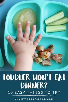 toddler's hand reaching for food in a blue tray with text overlay that reads, toddler won't eat dinner? 10 easy things to try