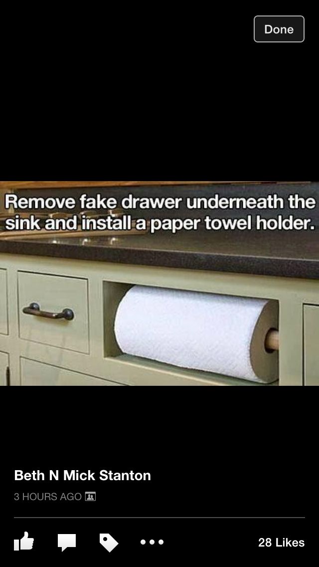 an image of a roll of toilet paper sitting on top of a counter next to drawers