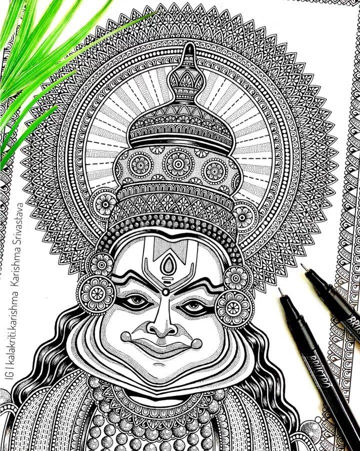 a drawing of the face of lord hanshma on paper with two pens next to it