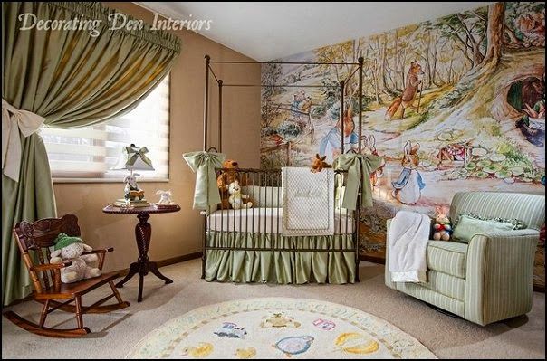 a baby's room with a mural on the wall and a crib next to it