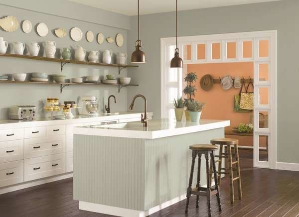 the kitchen is clean and ready to be used for cooking or baking, with many plates on the wall